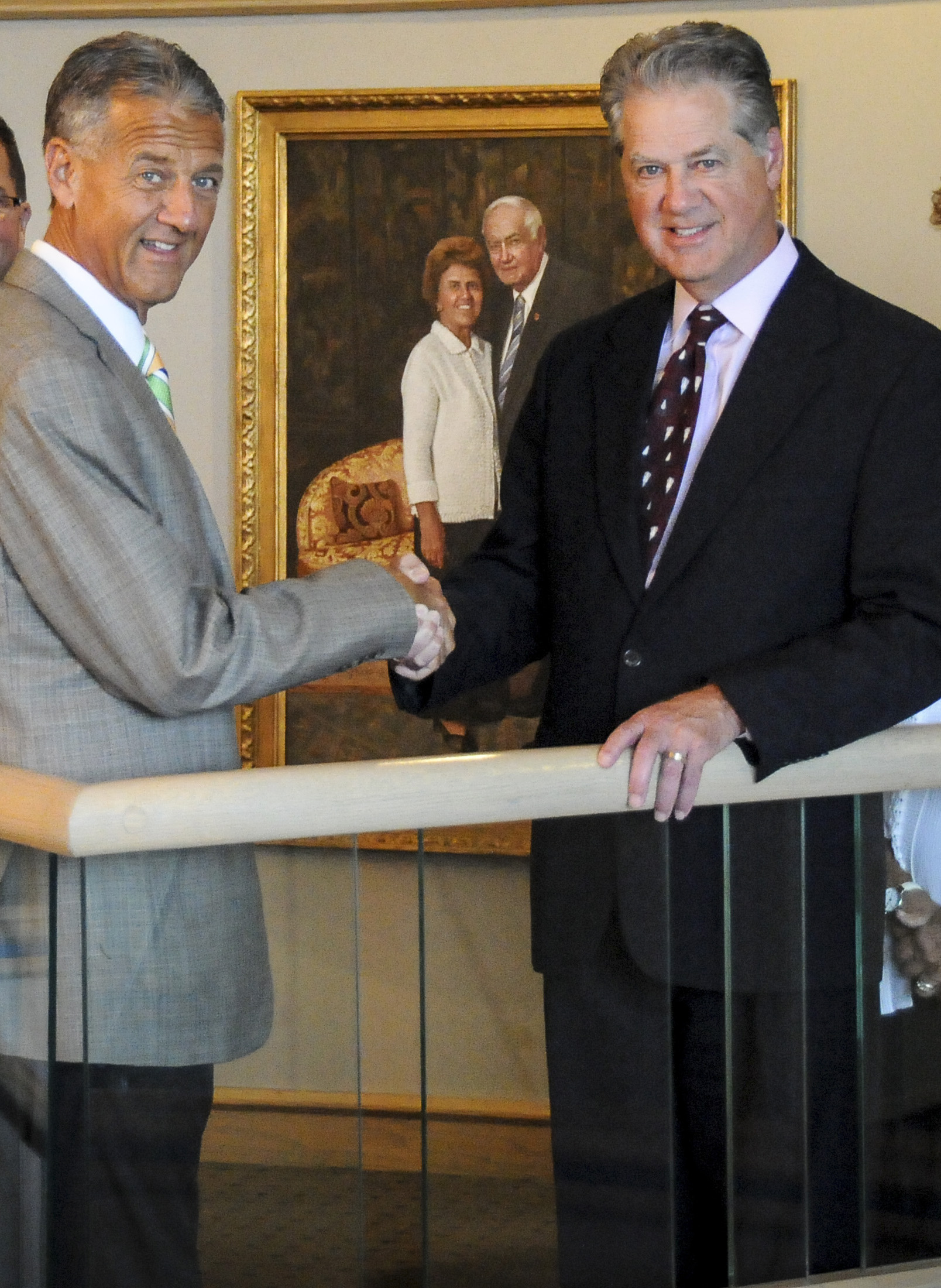 J.M. Herr and Ed Herr shaking hands